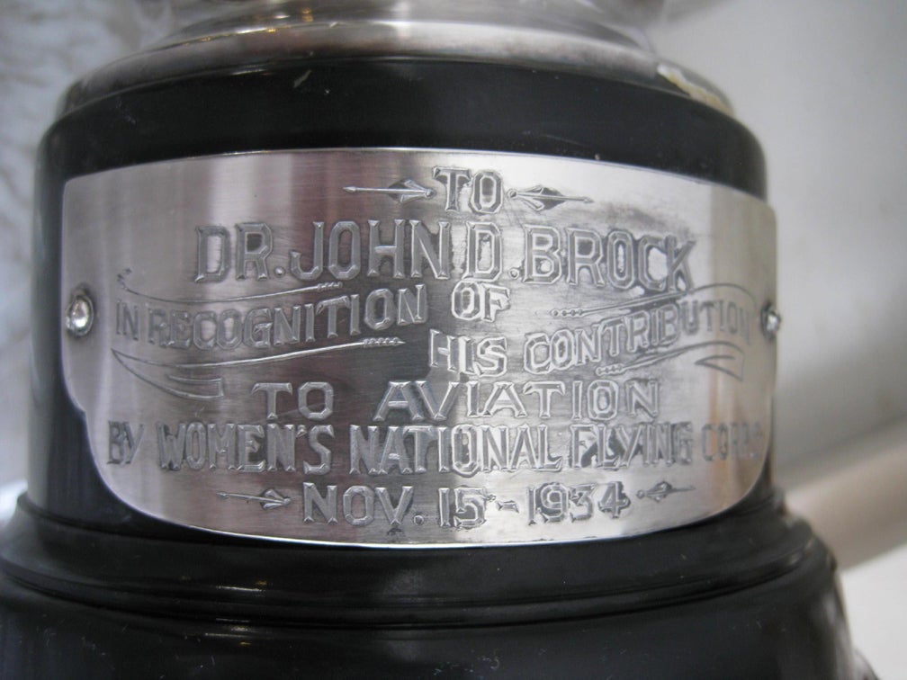 This important Aviation trophy was awarded in 1934 to Dr. John D. Brook known in the era as “American Most Prolific Flyer”. In 1933 he completed four years of consecutive daily flights. The 16 ¾” high trophy, which is mounted on a brown Bakelite