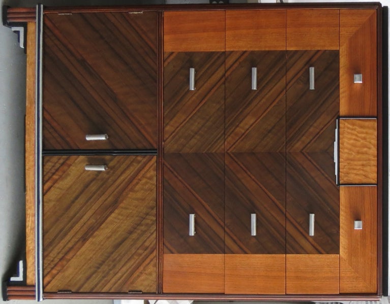 This stunningly beautiful skyscraper design American art deco bedroom set was made by Northern Chicago Furniture Company in the early 1930’s.  Constructed of exotic veneers of macassar ebony, walnut and birdseye maple with silver leaf and ebonized