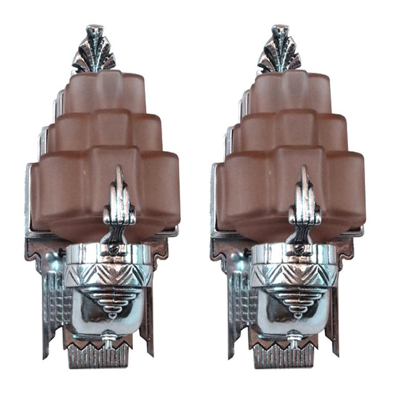 Pair American Art Deco Sculptural Aluminum 
Pink Glass Sconces