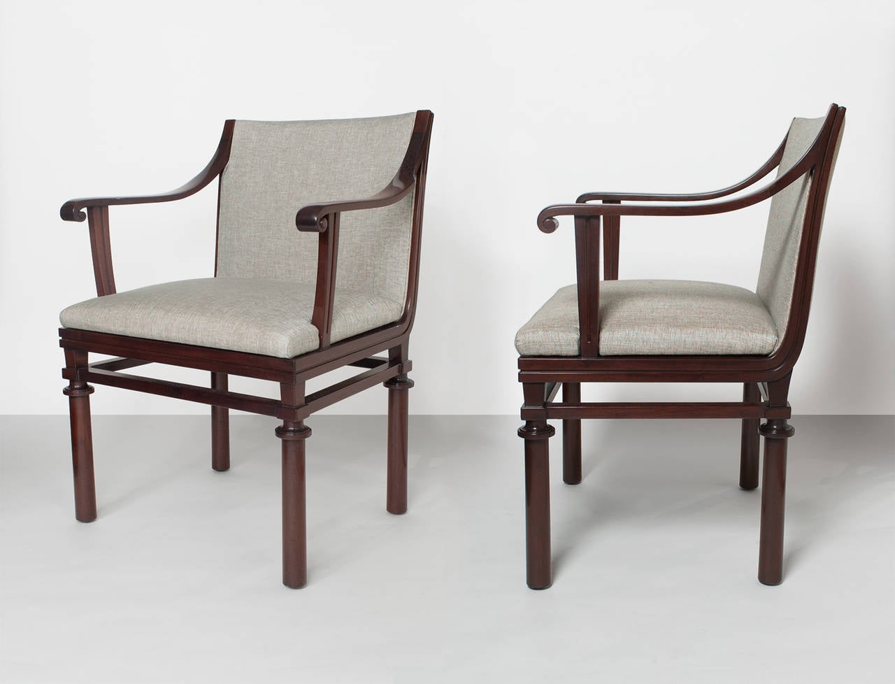 Pair of fine Swedish art deco solid Cuban mahogany armchairs designed by Carl Malmsten for NK (Nordiska Kompaniet) Stockholm. Newly restored and upholstered. Metal tags and 