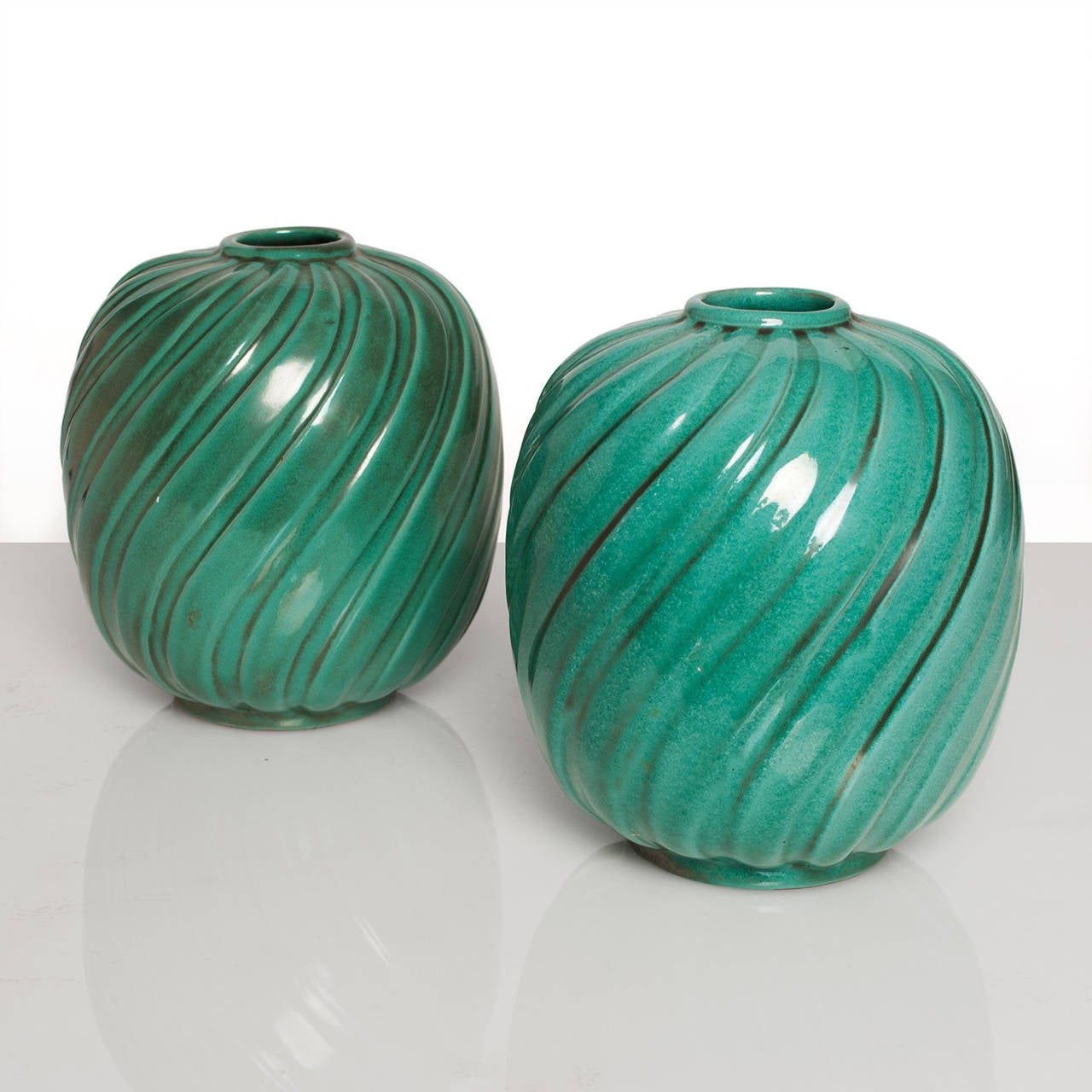 Pair of Scandinavian Modern vases designed by Anna-Lisa Thomson with copper oxide glaze. Made by Upsala Ekeby, circa 1930s. Other pieces available.