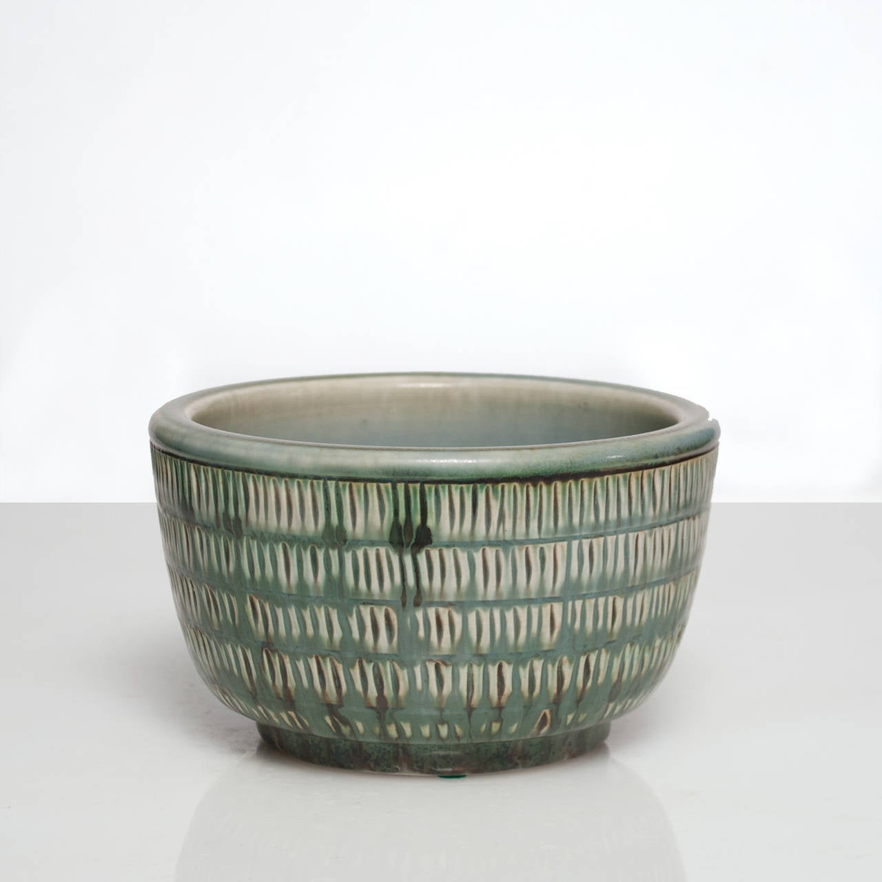 Glazed Swedish art deco ceramic bowl by Gertrud Lonegren in green glaze.