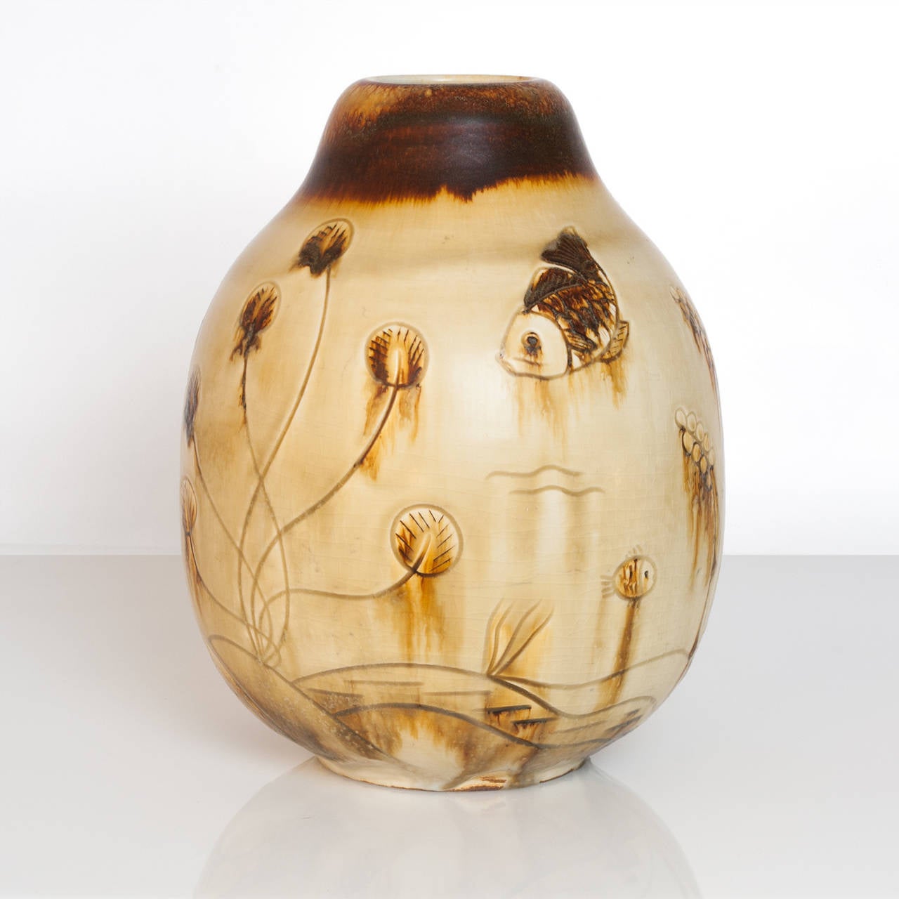 Large Scandinavian Modern unique ceramic studio vase by Gertrud Lonegren for Rorstrand. This vase depicts an underwater scene with various fish and plants. Her pieces are known for textured surfaces combined with subtle use of glazes. Created circa