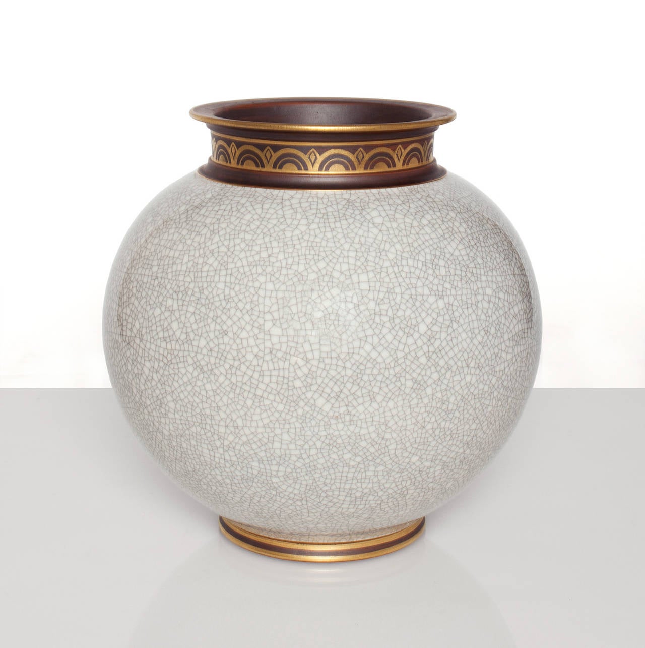 Large Swedish Art Deco vase designed by Gunnar Nylund for ALP (LIdkoping) body in white crackle glaze, foot and mouth in a brown glaze, both are detailed in gold. Signed. 10.5