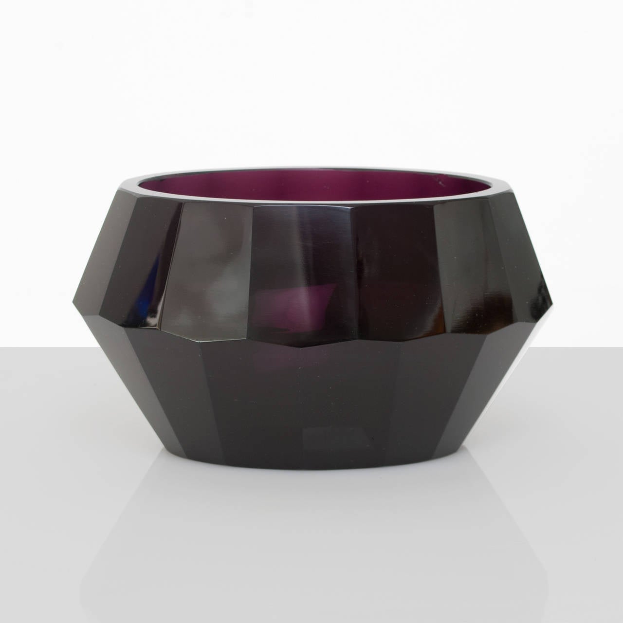 Faceted amethyst colored glass bowl in oval shape with highly polished surface. Attributed to Moser & Sohne, Austria. Bowl in in very good condition bottom surface with wear. Length 8.5