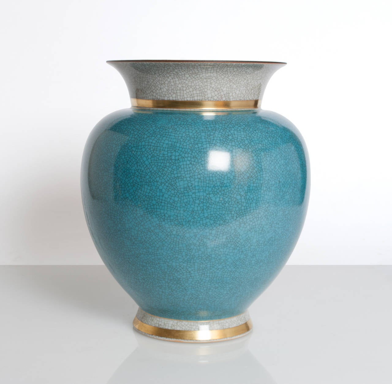 Very large Royal Copenhagen ceramic vase in blue and white (craquelure) crackle glaze and detail in gold. Made in Denmark circa 1940's. 
Height 12
