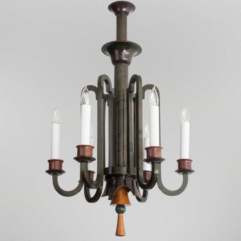 Unique Swedish Art Deco chandelier made from carved nordic birch. The wood is stained a dark green and medium brown and finished with a high shine polish. Newly re-electrified with US standard base sockets, excellent condition. Height: 34.5