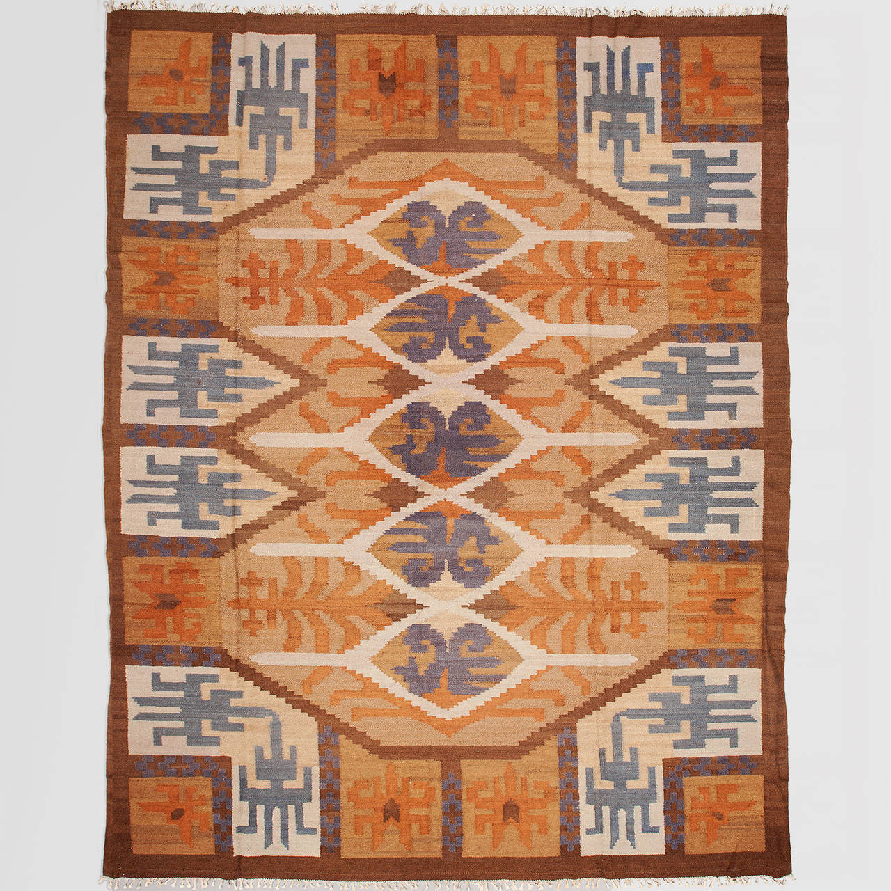 Large Swedish art deco flat weave (Rölakan) rug with geometric design in blues, orange, cream and brown. Dimension  13’ x 10’3”, Just professional cleaned, minor wear and some small spots.