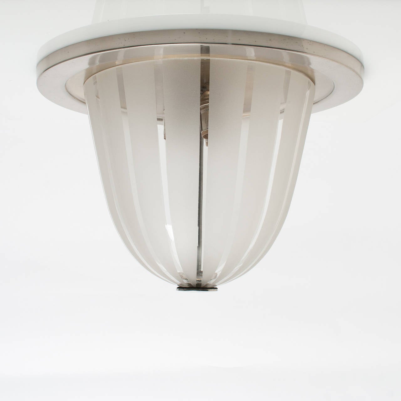 (2) Scandinavian Modern flush mount fixtures with clear and acid etched striped glass shades. Mounts and finials are nickel plated brass. Newly rewired with 3 standard bulb sockets each. Original finish, some tarnished spots. Probably made by