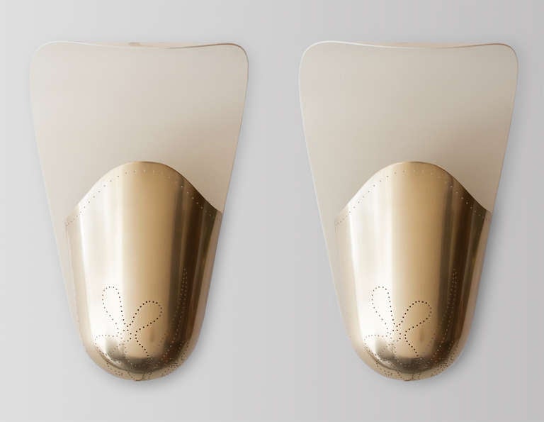 Scandinavian Modern Pair Of Finnish Mid-century Wall Sconces In Polished Perforated Brass.