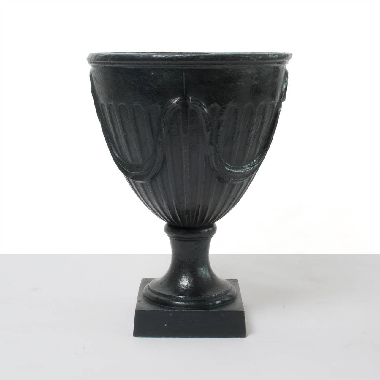 20th Century Pair of Swedish Art Deco Cast Iron Garden Urns on Plinths with Garland Relief