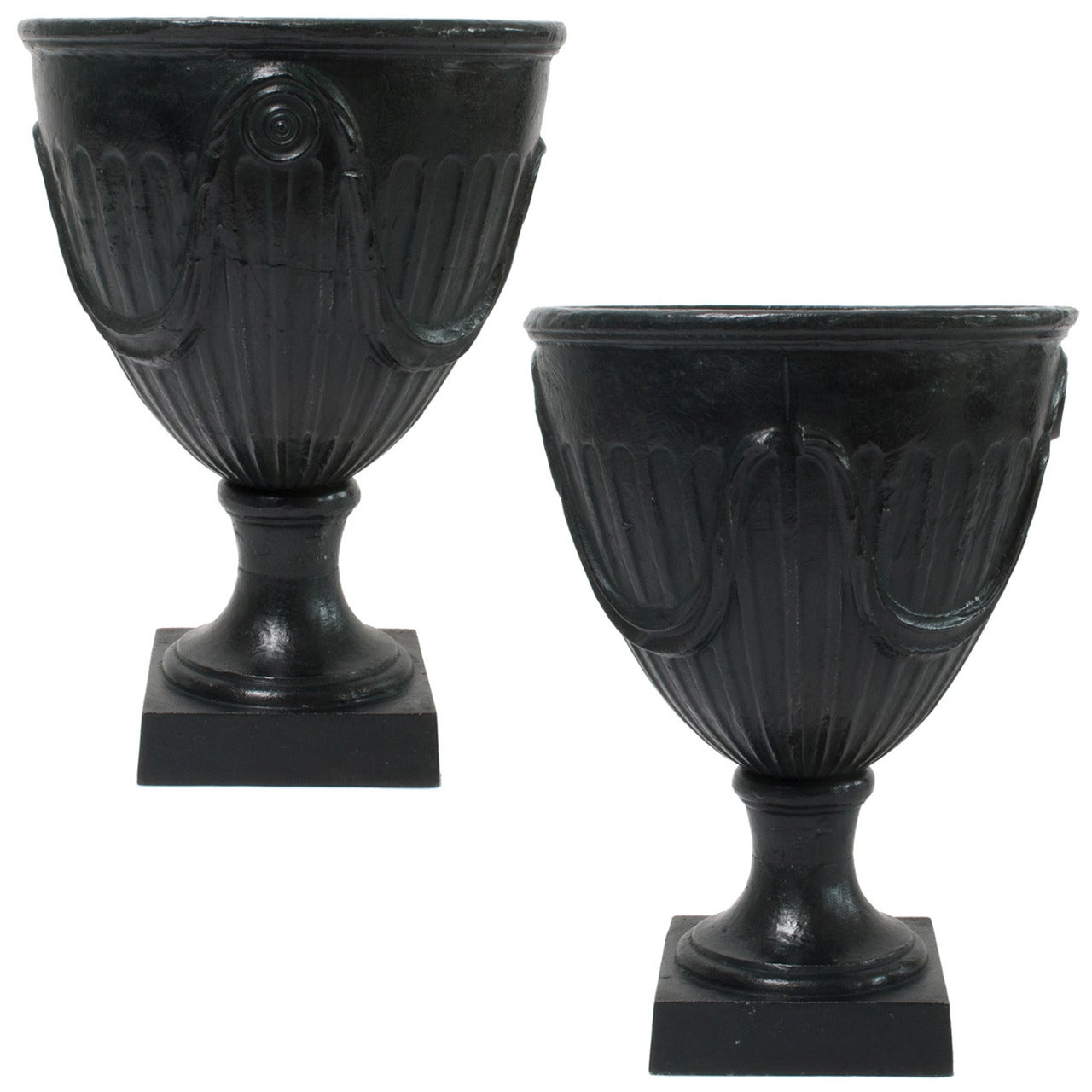 Pair of Swedish Art Deco Cast Iron Garden Urns on Plinths with Garland Relief