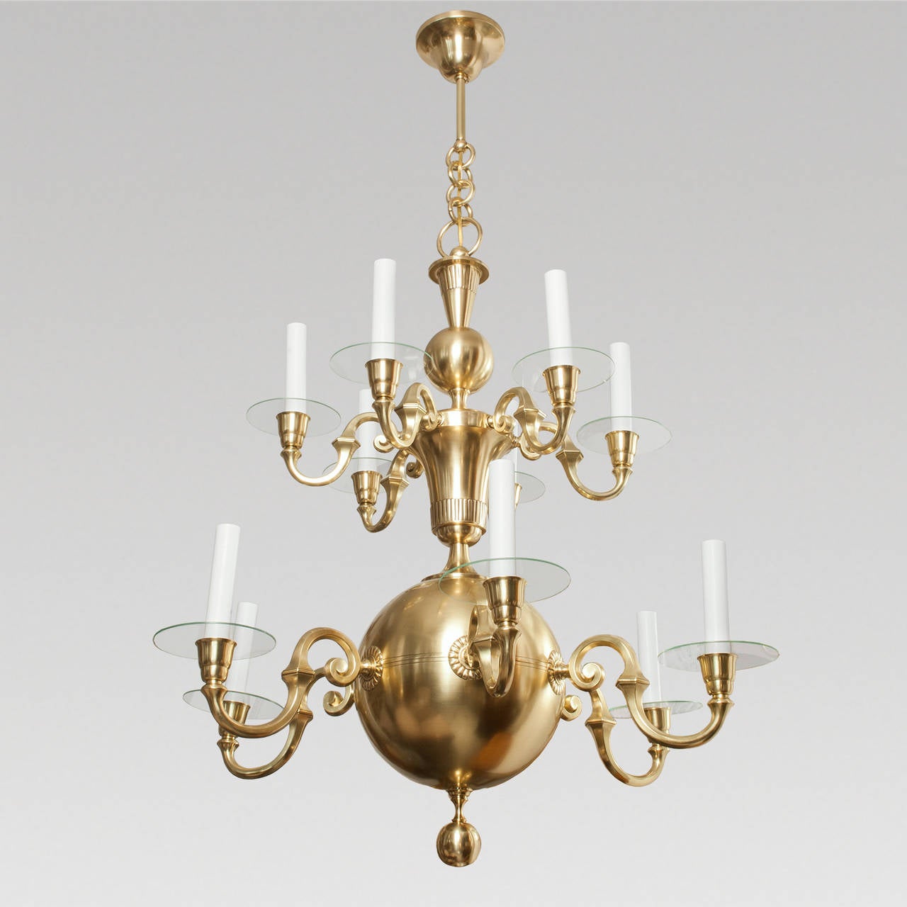 A large polished brass Swedish Art Deco twelve-arm chandelier designed by Elis Bergh for the company C.G. Hallberg, Stockholm, circa 1928-1933. The chandelier has been completely restored, polished and lacquered body, new wiring with standard base