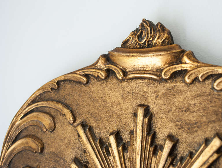 Gilt wood Swedish Art Deco mirror with sunburst and oil lamp motif. In Excellent Condition In New York, NY