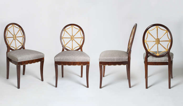 Elegant set of 4 Swedish art deco chairs designed by Otto Schulz, made of stained solid birch. Backs are carved gilt wood and the seats have carved scallop details on 3 sides. Restored and reupholstered. Chairs are documented in the book 