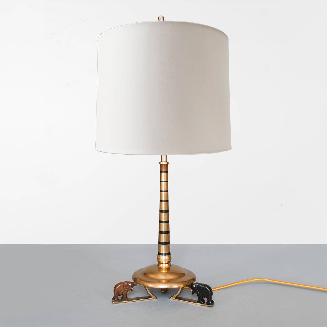 Swedish Art Deco gilded brass lamp with ebony wood elephants.