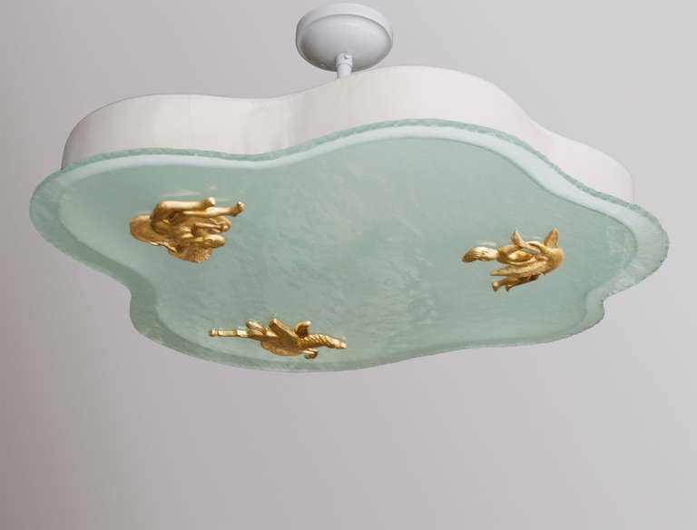 Scandinavian modern Hans Bergström designed for Atelje Lyktan, ceiling pendant with a chiseled edge glass shaped in the form of a cloud. The glass has a rippled surface and its reverse side is acid etched. Three mythical characters in gilt cast