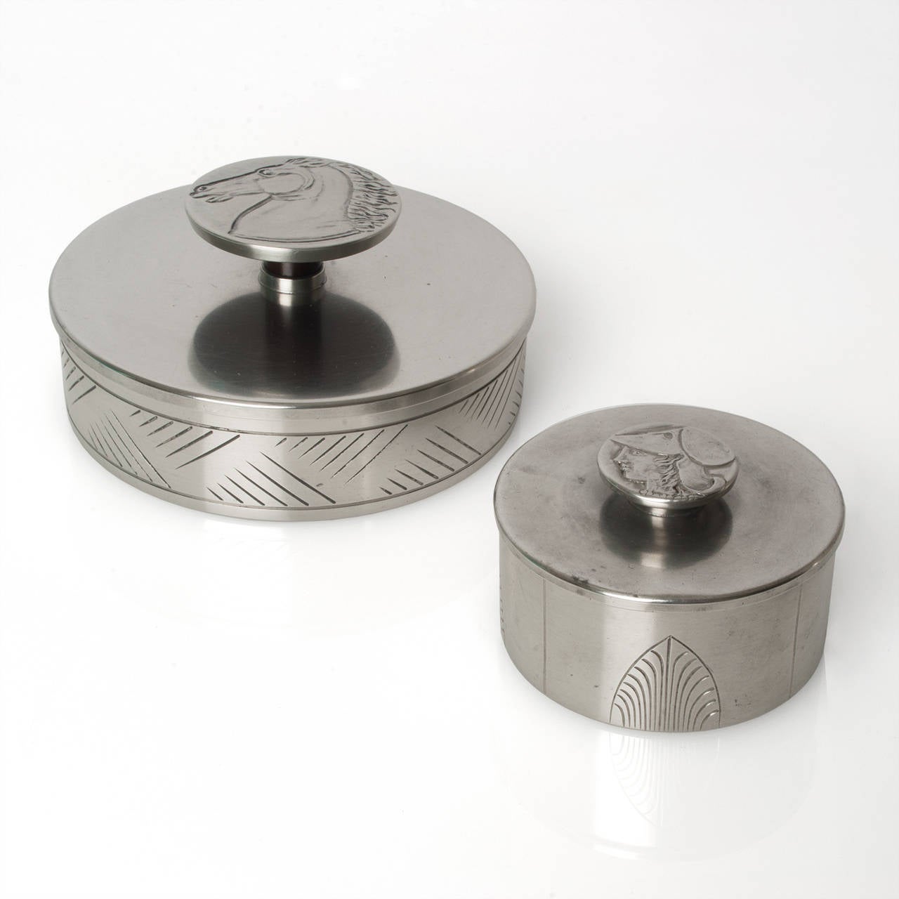 Two Swedish art deco pewter boxes designed by Oscar Antonsson for Ystad Metall. These pieces are from the 