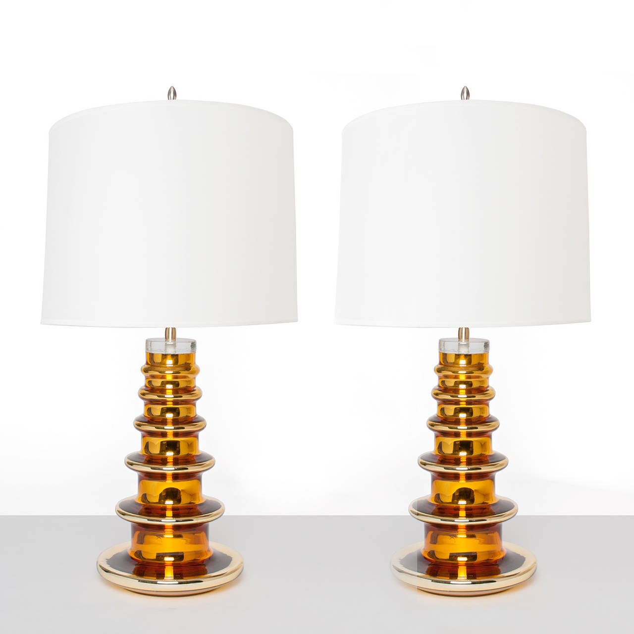 Pair of Swedish mid-century modern gold mercury glass lamps by Gustav Leek, Orrefors circa 1960. Newly electrifed with polished brass hardware double socket clusters. Overall H: 28