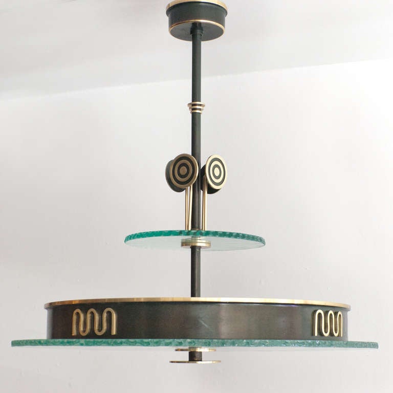 Polished Swedish Art Deco pendant of patinated and polished brass from Bohlmarks.