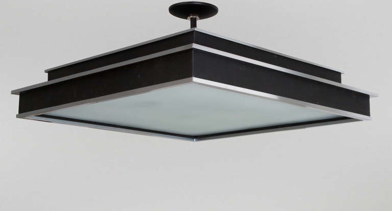 Swedish Art Deco stepped ceiling fixture in painted and polish white steel.
