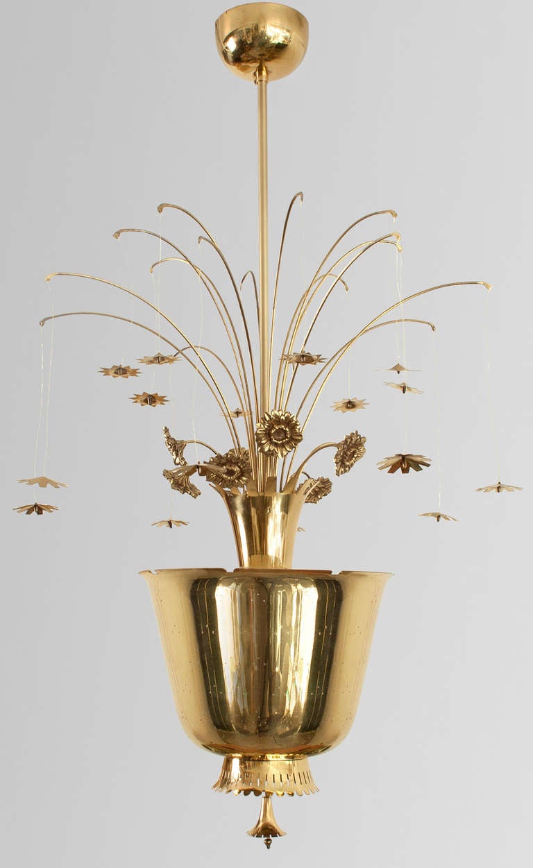 Paavo Tynell chandelier of pierced brass, with cast and formed brass flowers