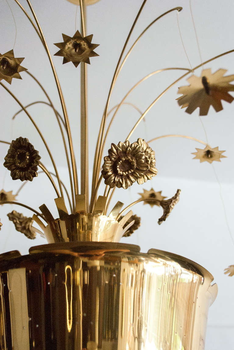 20th Century Paavo Tynell chandelier of pierced brass, with cast and formed brass flowers