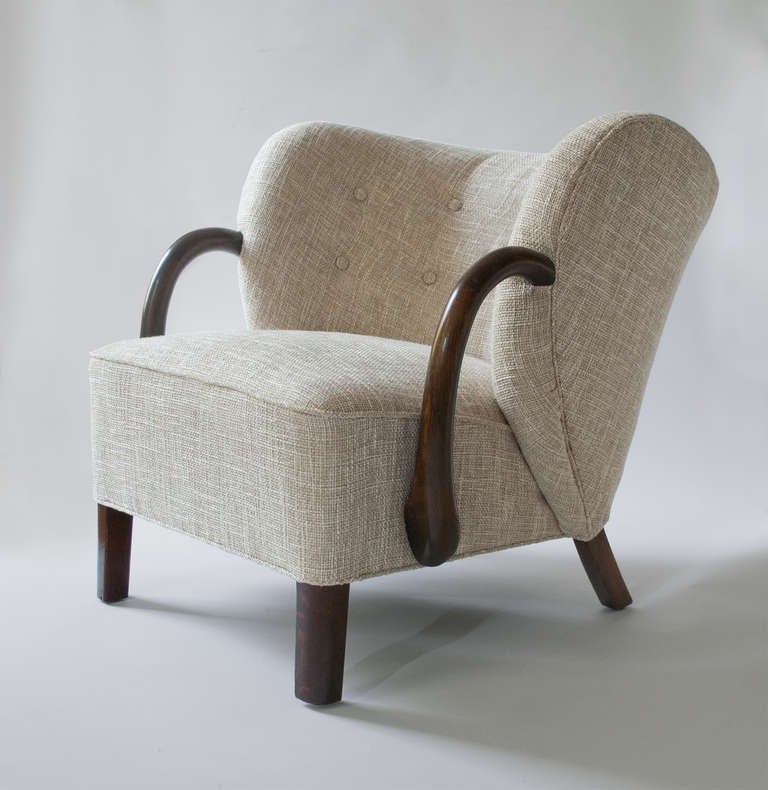 Mid-20th Century Danish Art Deco upholstered armchair with stained oak details, attrib. Viggo Boesen