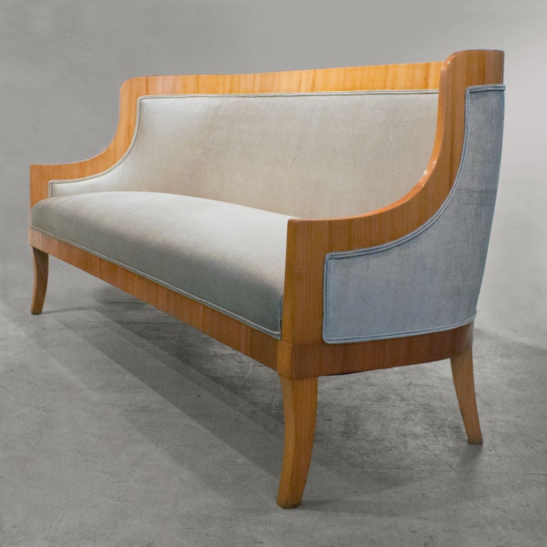 Elegant Swedish Art Deco sofa designed by architect Carl Bergsten for the luxury ocean liner M/S Kungsholm, matching chairs also available. The chairs are documented in the 1928 photograph of one of the Kungsholm's reading rooms. Sofa is elm wood