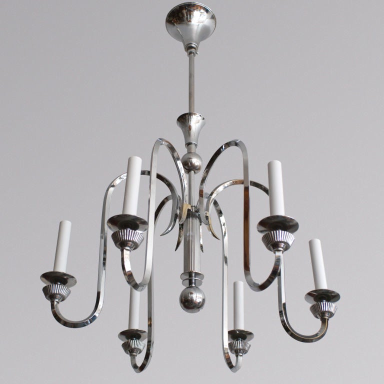 Graceful, Danish Art Deco 6-arm chandelier in chromed brass. Each arm cascades from a center reeded column which is accented with sphere's and rings. Newly electrified, uses candelabra base bulbs. Made in Denmark, circa 1930. Diamter:21.5