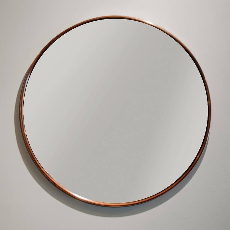 Swedish art deco mirror with polished copper frame.