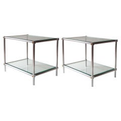 Chic pair of polished aluminum tables with gilded details.
