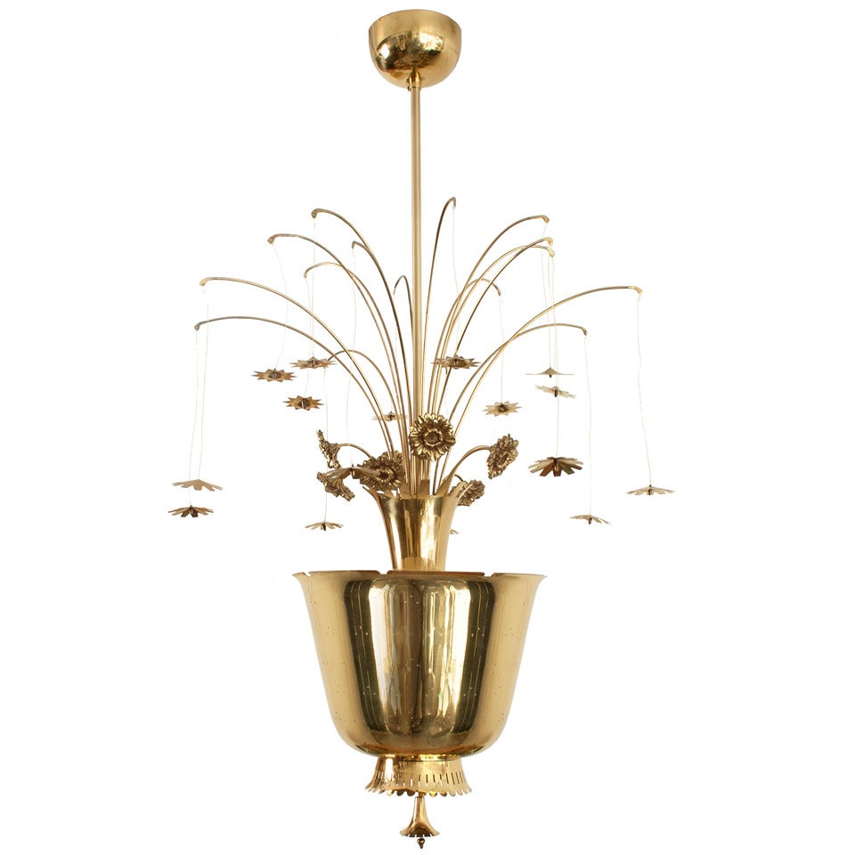 Paavo Tynell chandelier of pierced brass, with cast and formed brass flowers
