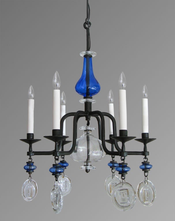 Swedish 6-arm chandelier with hand wrought iron frame with blue and clear glass. Designed by Erik Hoglund for Boda Nova Glassworks/Axel Stromberg Ironwork, Sweden circa 1960's. Newly electrified for candelabra base sockets. Height 27