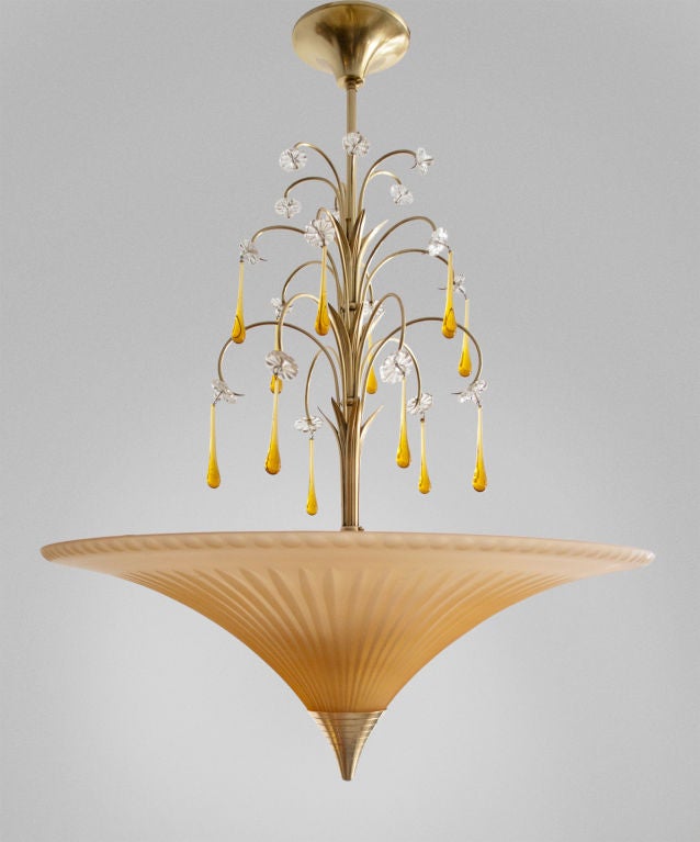 Elegant Swedish art deco, etched light amber colored glass chandelier with tear drop crystal fountain. Newly polished and lacquered brass frame, canopy and finial, all original. Designed Bohlmarks, 1920's, Swedish Grace. Height: 28