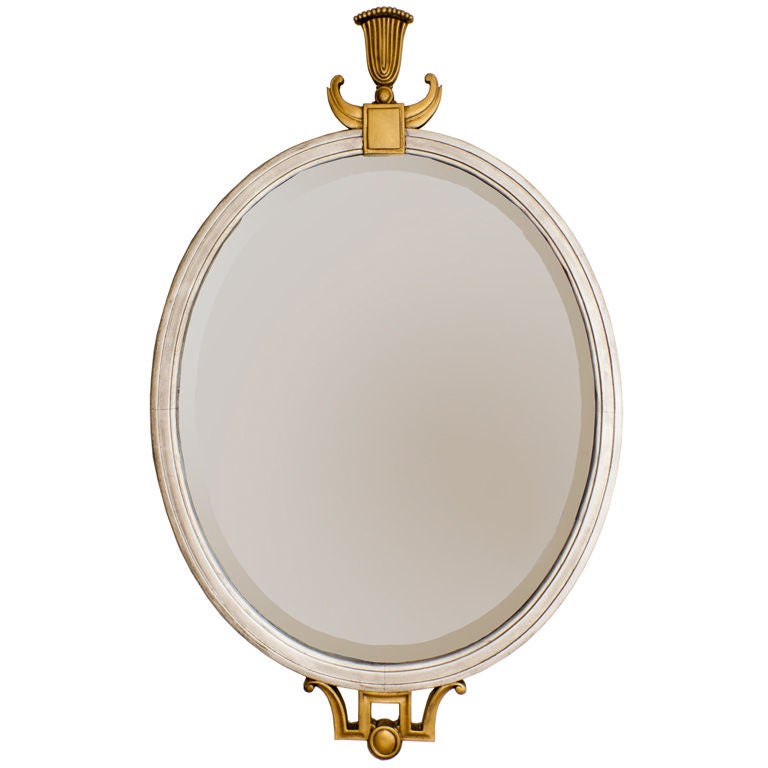 Elegant 1920 Swedish Art Deco gilt and silver oval wood mirror.
