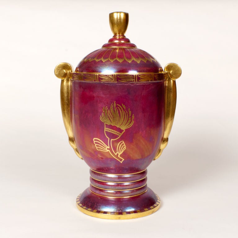 Impressive and rare Swedish art deco ceramic covered urn in red luster glaze hand decorated with gold. Designed by Josef Ekberg for Gustavsberg, dated 1932. Excellent condition. Height 16