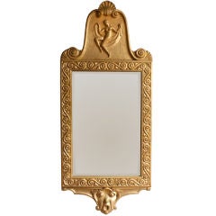 Swedish Art Deco carved gilt wood figural mirror.