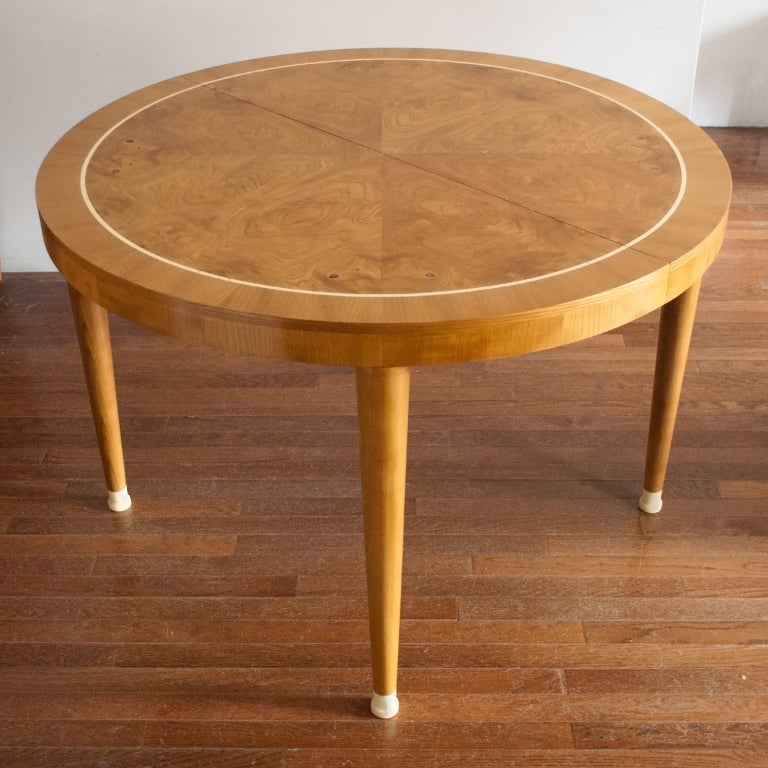 Beautiful Swedish art deco dining / game table in ash with book matched burl wood top. Table's top has an inlay of ivory colored bakelite and bakelite feet.<br />
Diameter 43.25
