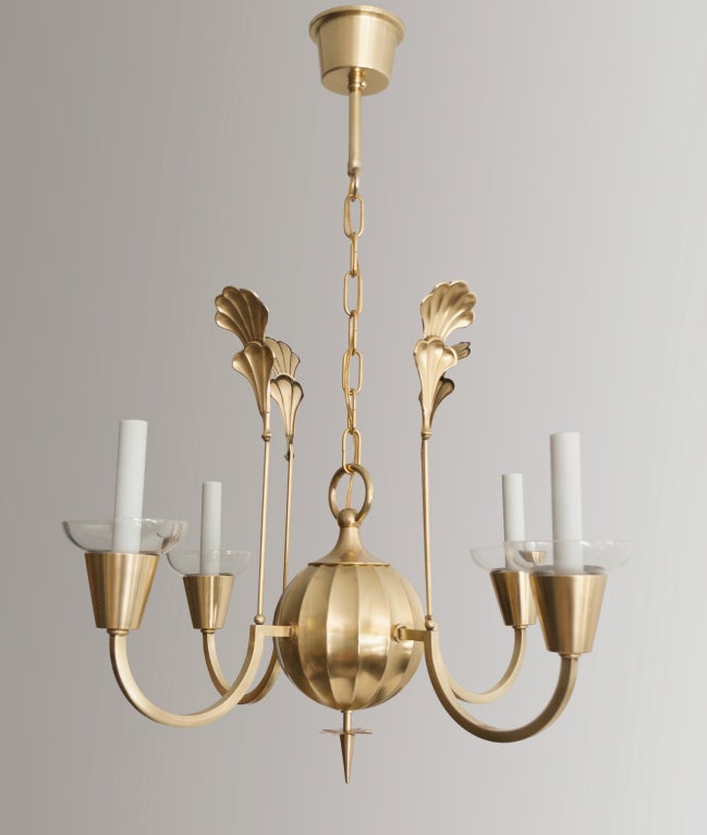 An elegant Swedish Art Deco polished 4-arm brass chandelier designed by Elis Bergh for C.G. Hallberg silversmith, Stockholm. Newly electrified for candelabra base bulbs each arm has a clear glass bobeche. Made circa 1925. H:28.5