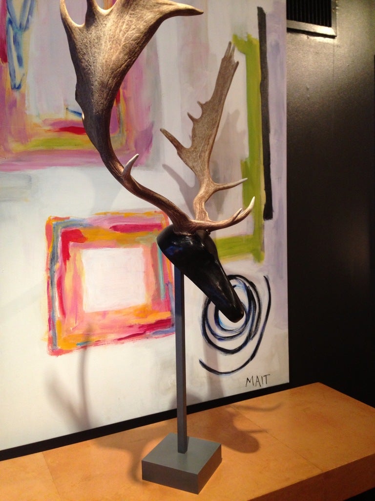 Fallow Deer Antlers mounted on carved wood form and steel stand. Available in ebonized wood or partially gilded.