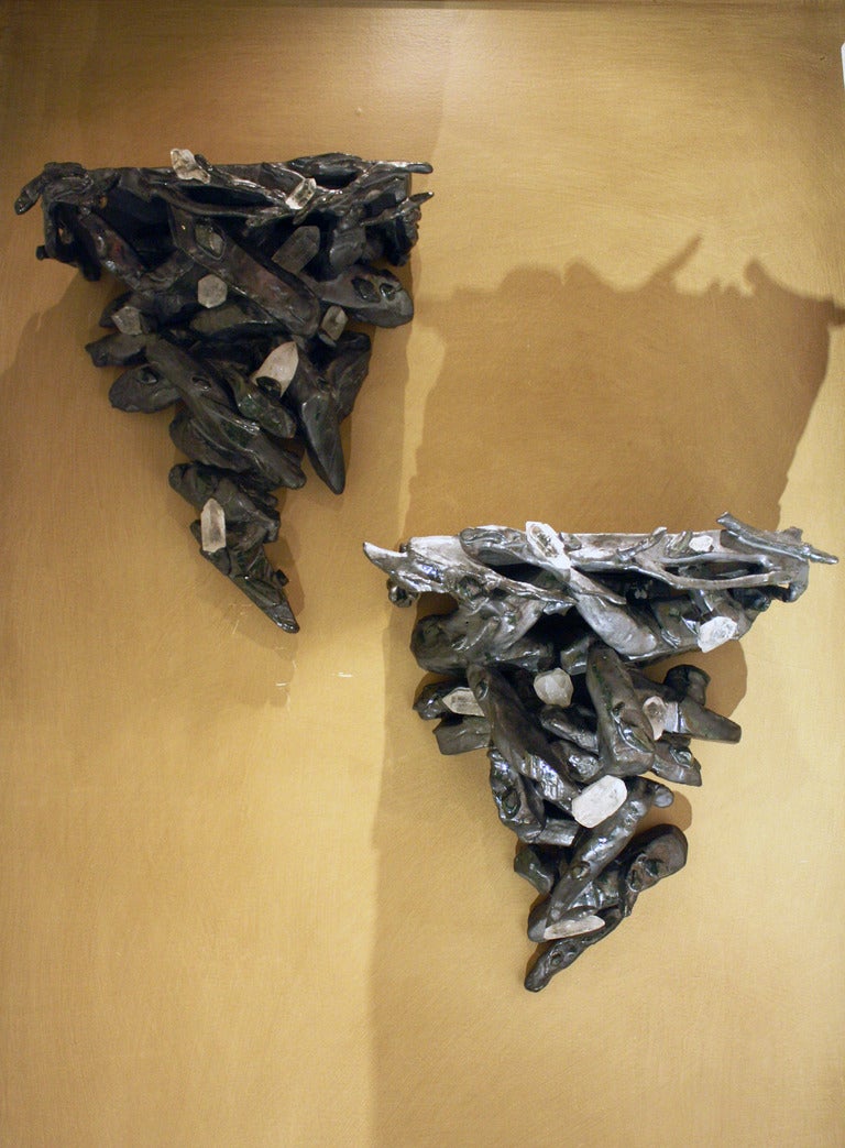 Pair of Rocaille Copper Glazed Ceramic & Rock Crystal Wall Brackets by Eve Kaplan.
Kaplan’s handmade, earthenware pieces are infused with inspiration from 18th century gilded pieces.  They have drawn comparisons to the Mid-Century work of Line