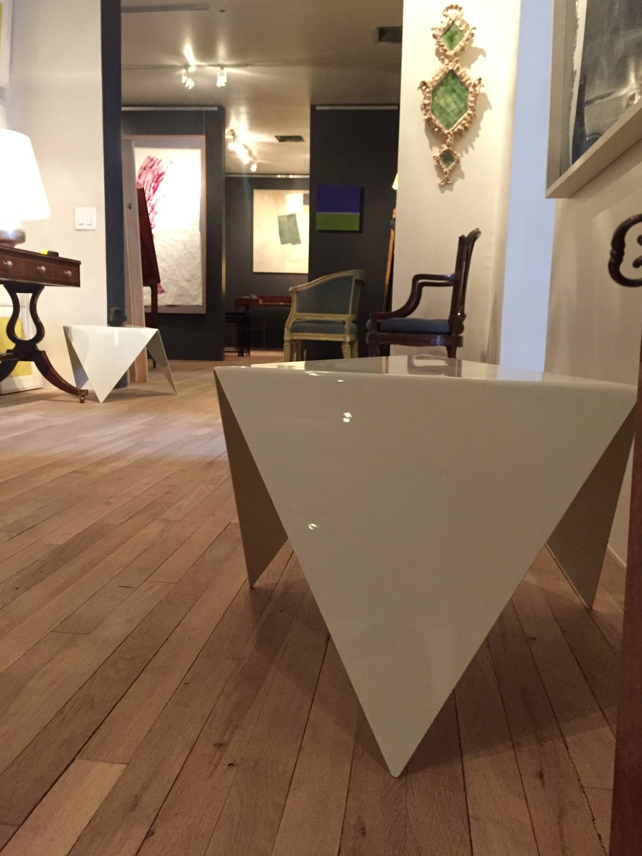 Cream lacquered steel triangular low table.
By Gerald Bland.
Available in polished steel, cream, grey, or custom finish.