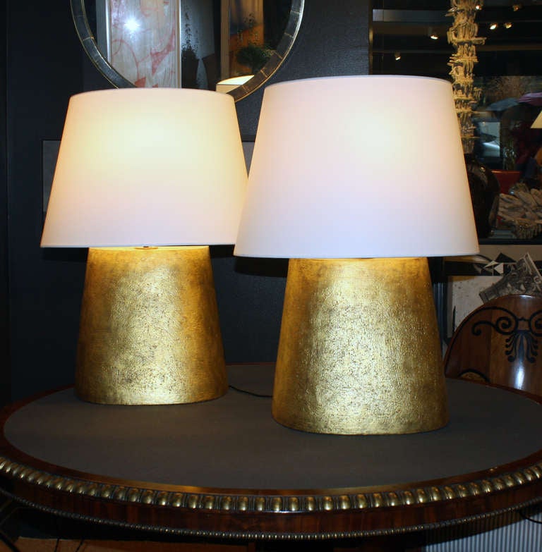 Pair of hand- coiled gilded ceramic flat back lamps by Andrea Koeppel. Available custom/by commission, measurements include custom lampshades.

Models of understated luxury, Koeppel’s gilt pieces are made in the hand-coiled tradition and fired