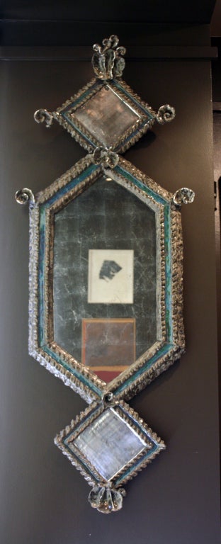 Rocaille blue glazed ceramic and palladium leaf lozenge mirror by Eve Kaplan. Available as custom order.