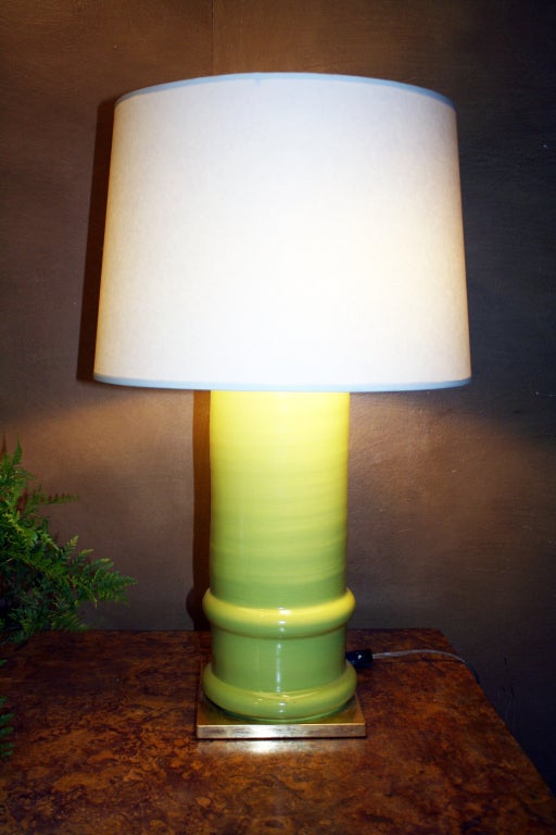 Apple green glazed ceramic cylindrical lamp designed by Gerald Bland. Adjustable. Available for custom order singly or as pairs and in custom colors.