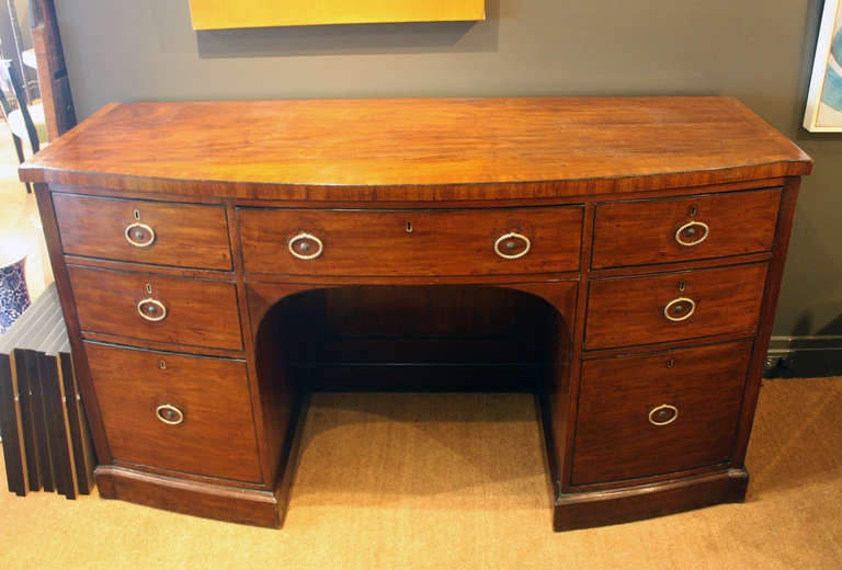 Sheraton mahogany bow front sideboard.