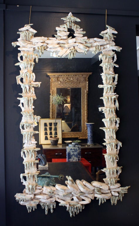 Chinoiserie Rocaille Cream Glazed Ceramic Mirror by Eve Kaplan. Available as custom order

Eve Kaplan’s handmade, earthenware work is infused with inspiration from 18th century gilded pieces.  They have drawn comparisons to the Mid-Century work of