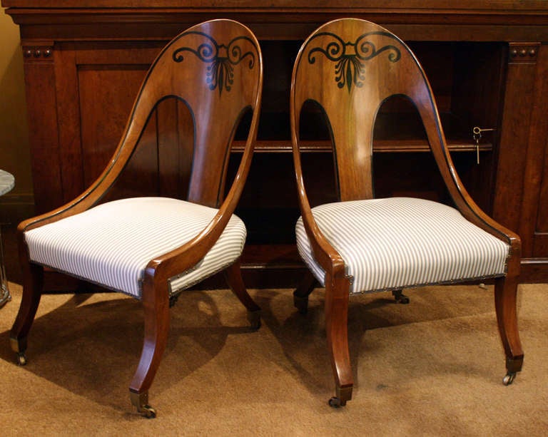 Pair of regency inlaid mahogany spoonback chairs.
