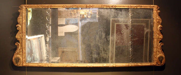 Queen Anne gilt gesso over mantel mirror. With original gilding and beveled glass.